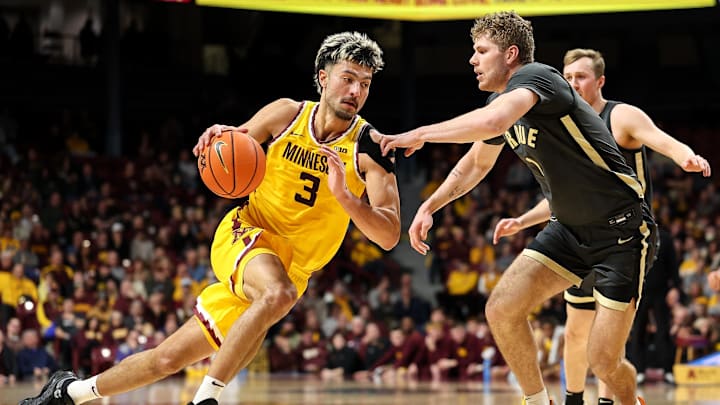 Jan 2, 2025; Minneapolis, Minnesota, USA; Minnesota Golden Gophers forward Dawson Garcia (3) drives towards the basket as Purdue Boilermakers forward Caleb Furst (1) defends during the first half at Williams Arena. Mandatory Credit: Matt Krohn-Imagn Images