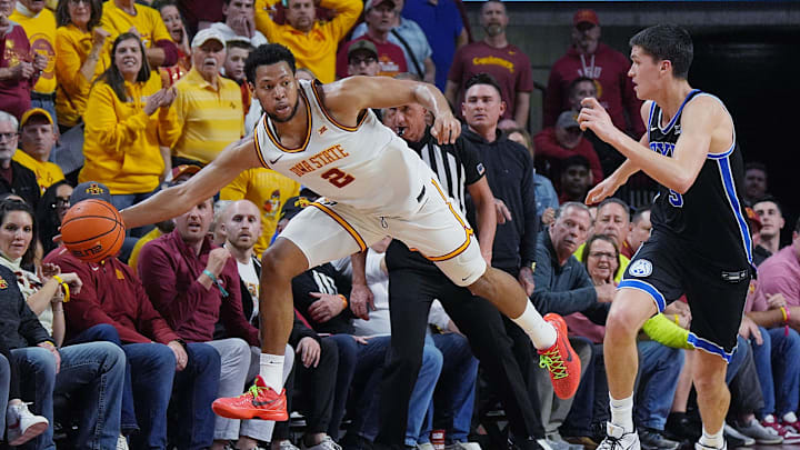 Iowa State Cyclones forward Joshua Jefferson (2) passes the ball around BYU Cougars's guard Egor Demin (3) during the second-over-time game in the Big-12 men’s basketball in the Senior Day at Hilton Coliseum on March 4, 2025, in Ames, Iowa. Iowa State Cyclones forward Joshua Jefferson (2) passes the ball around BYU Cougars's guard Egor Demin (3) during the second-over-time game in the Big-12 men’s basketball in the Senior Day at Hilton Coliseum on March 4, 2025, in Ames, Iowa.