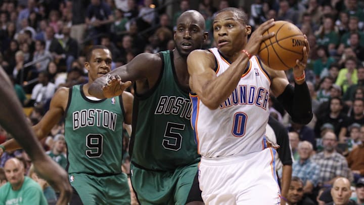 Russell Westbrook drives with Kevin Garnett in pursuit in 2012. Russell Westbrook drives with Kevin Garnett in pursuit in 2012.