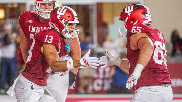 Indiana’s Elijah Sarratt (13) and Carter Smith celebrate a touchdown against Illinois. Indiana’s Elijah Sarratt (13) and Carter Smith celebrate a touchdown against Illinois.