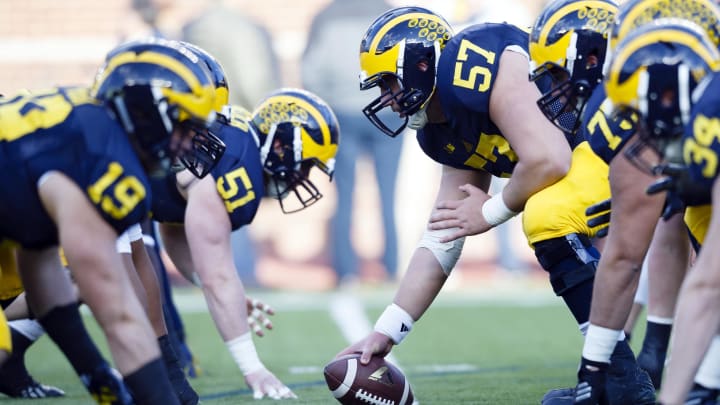 Apr 1, 2016; Ann Arbor, MI, USA; Michigan Wolverines offensive lineman Patrick Kugler (57) gets set to hike the ball during warm ups prior to the Spring Game at Michigan Stadium. Mandatory Credit: Rick Osentoski-USA TODAY Sports