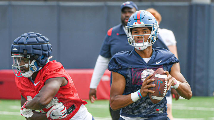 Quarterback Austin Simmons (8) throws a pass at Ole Miss football practice in Oxford, Miss., on Friday, Aug. 11, 2023.