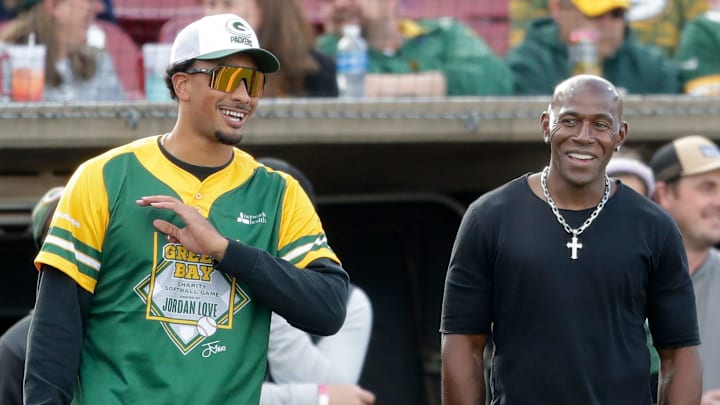 Green Bay Packers star Jordan Love talks with Donald Driver while hosting the Green Bay Charity Softball Game