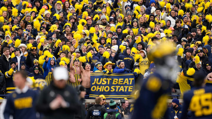 Nov 25, 2023; Ann Arbor, Michigan, USA; Michigan Wolverines fans cheer during the second half of the NCAA football game against the Ohio State Buckeyes at Michigan Stadium. Ohio State lost 30-24.