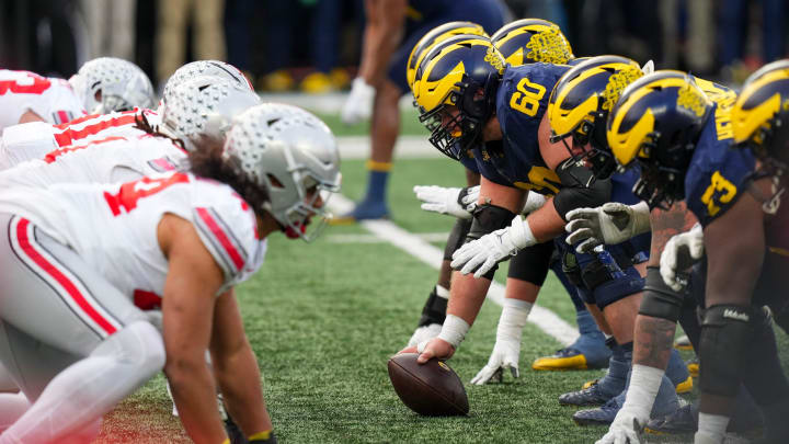 Nov 25, 2023; Ann Arbor, Michigan, USA; Michigan Wolverines offensive lineman Drake Nugent (60) prepares to snap the ball during the NCAA football game against the Michigan Wolverines at Michigan Stadium. Ohio State lost 30-24.