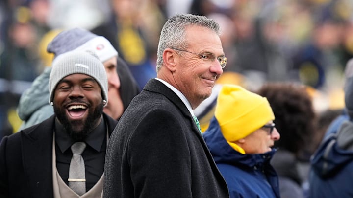 Nov 25, 2023; Ann Arbor, Michigan, USA; Former Ohio State Buckeyes head coach Urban Meyer watches from the sideline during the second half of the NCAA football game at Michigan Stadium. Ohio State lost to the Michigan Wolverines 30-24.