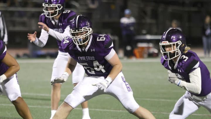 Carlsbad offensive lineman Andrew Langer blocks during the 2023 Open Division playoffs