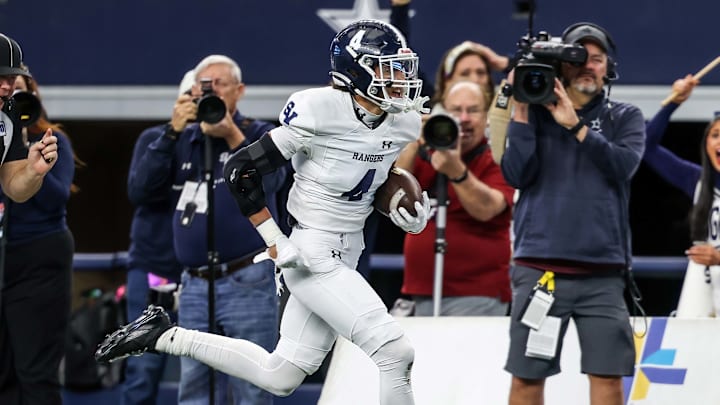 Defensive back Julian Colunga of Smithson Valley returns an interception for a touchdown during the first half of Texas 5A D1 state title game. Defensive back Julian Colunga of Smithson Valley returns an interception for a touchdown during the first half of Texas 5A D1 state title game.