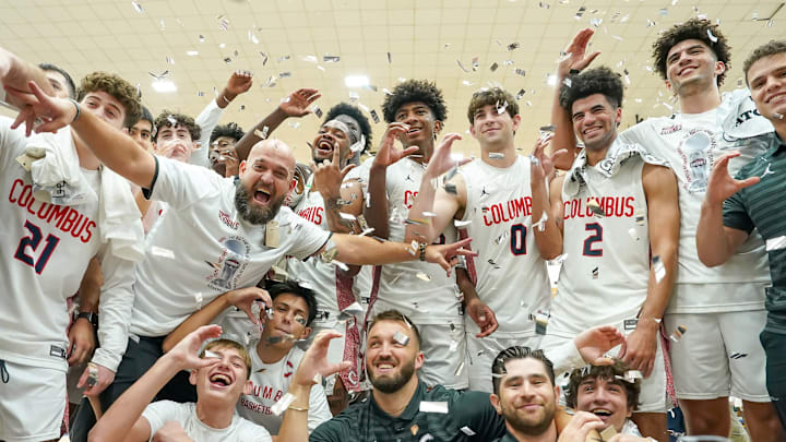 Columbus coaches and players celebrate winning the 2025 Chipotle Nationals boys championship with a victory over Dynamic Prep in Indiana.