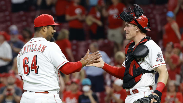 Reds pitcher Tony Santillan celebrates with Tyler Stephenson.