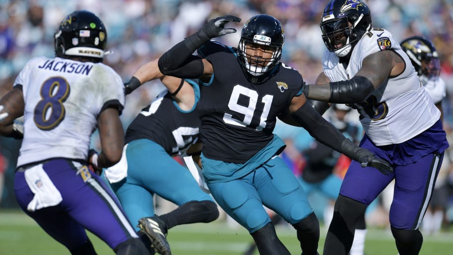 Jacksonville Jaguars defensive end Dawuane Smoot (91) goes after Baltimore Ravens quarterback Lamar Jackson (8) during early second quarter action at TIAA Bank Field in Jacksonville, FL Sunday, November 27, 2022. | Bob Self/Florida Times-Union / USA TODAY