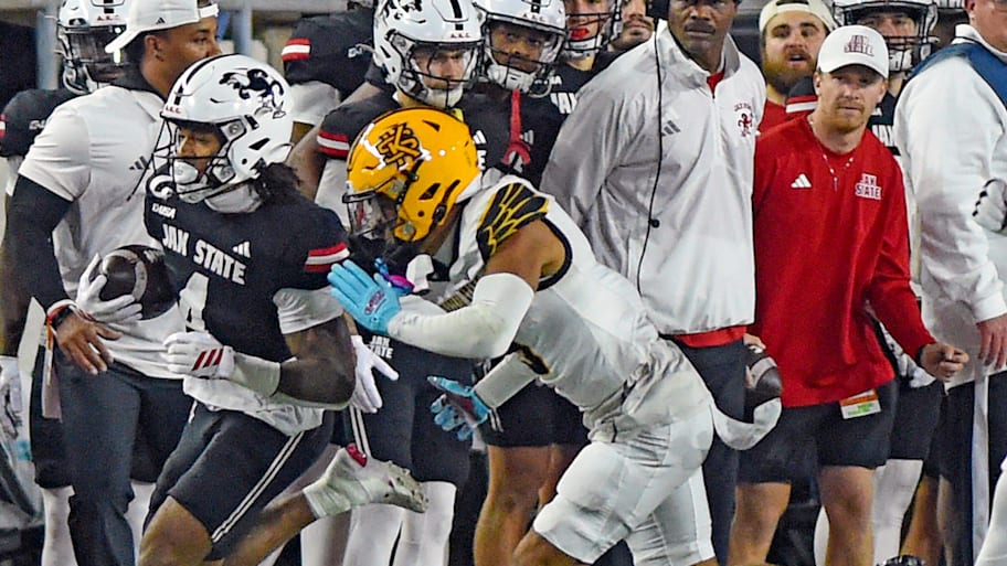 Jacksonville State’s Cam Cook tries to evade the tackle of Kennesaw State's Isaac Paul.