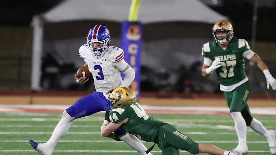 Folsom quarterback Ryder Lyons is tackled by St. Bonaventure's Dylan Dunst.