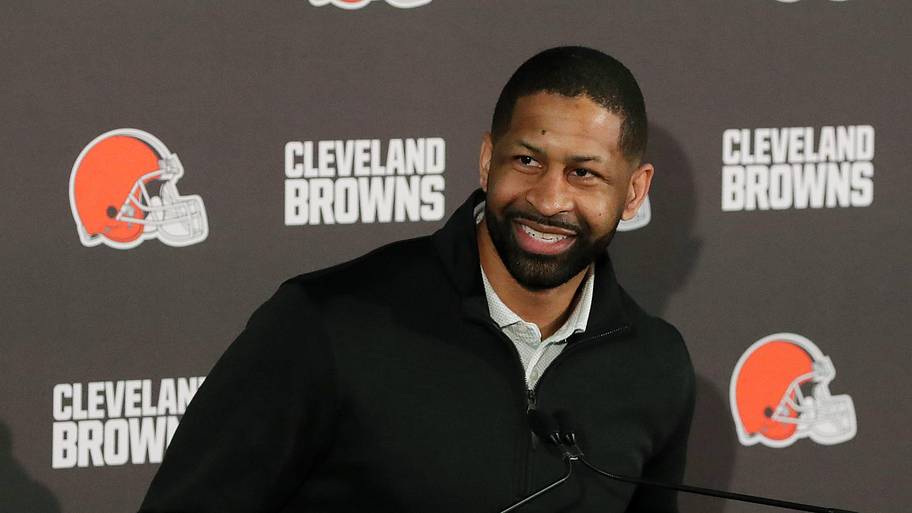 Andrew Berry smiles at a Browns press conference.