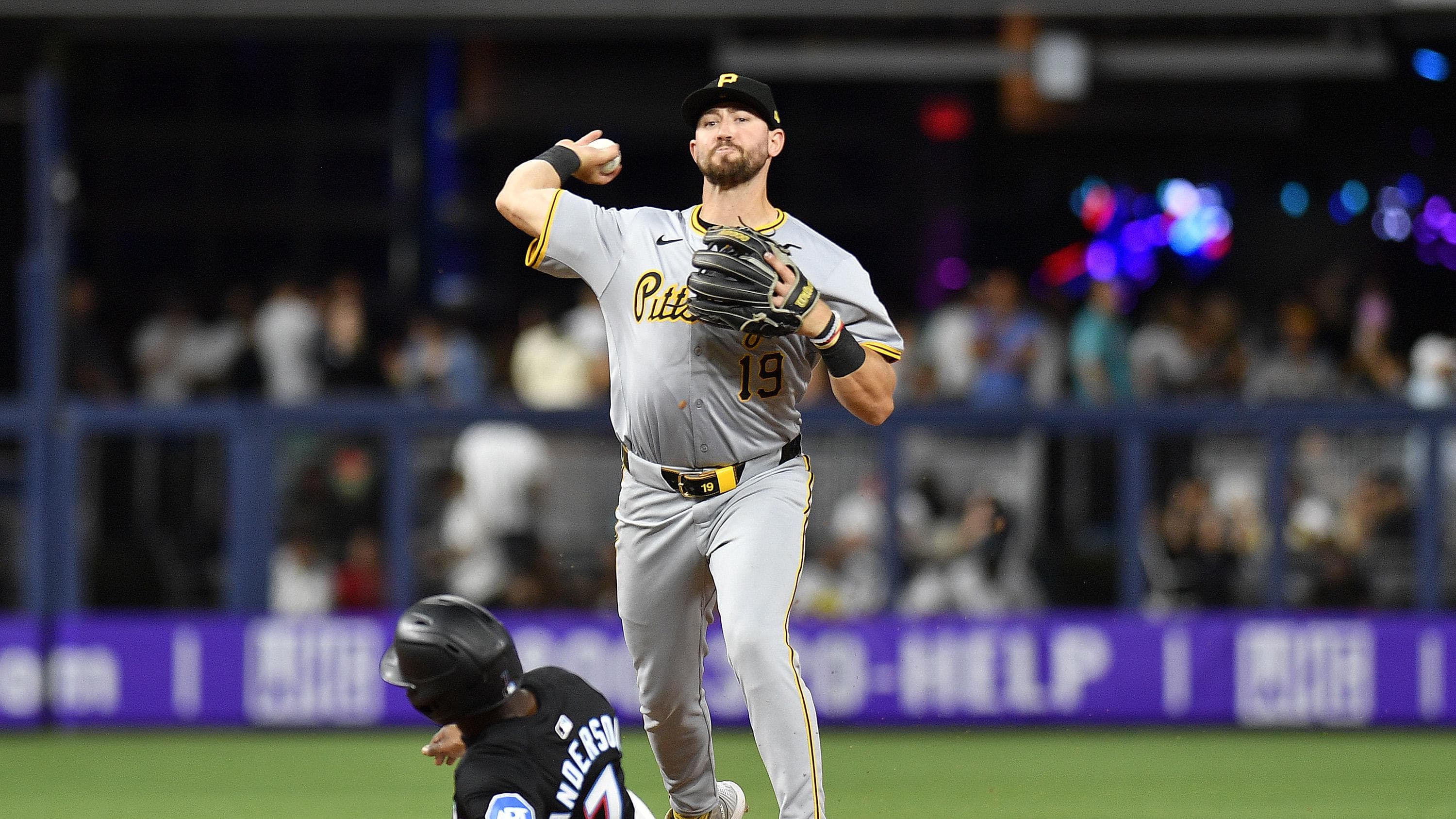 Mar 29, 2024; Miami, Florida, USA;  Pittsburgh Pirates second baseman Jared Triolo (19) turns a double play.