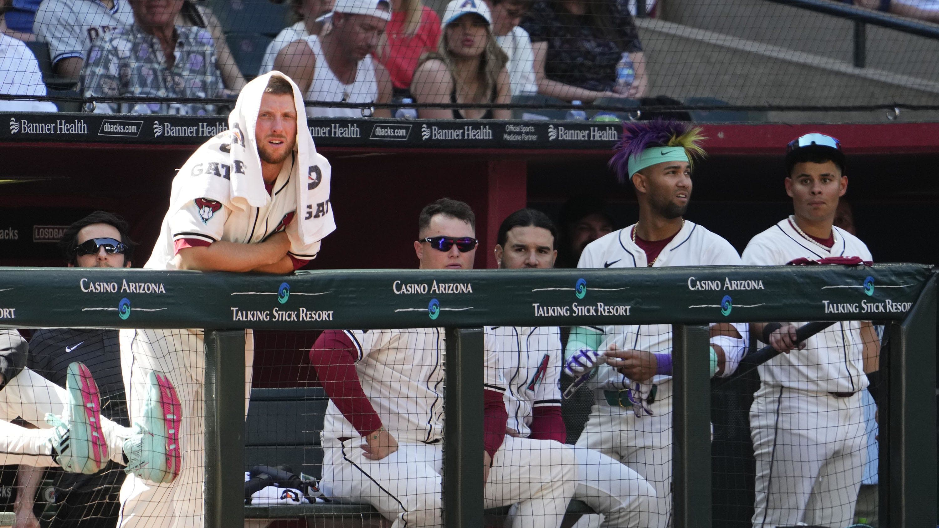 Arizona Diamondbacks starting pitcher Merrill Kelly (29) watches the action from the dugout against the Yankees