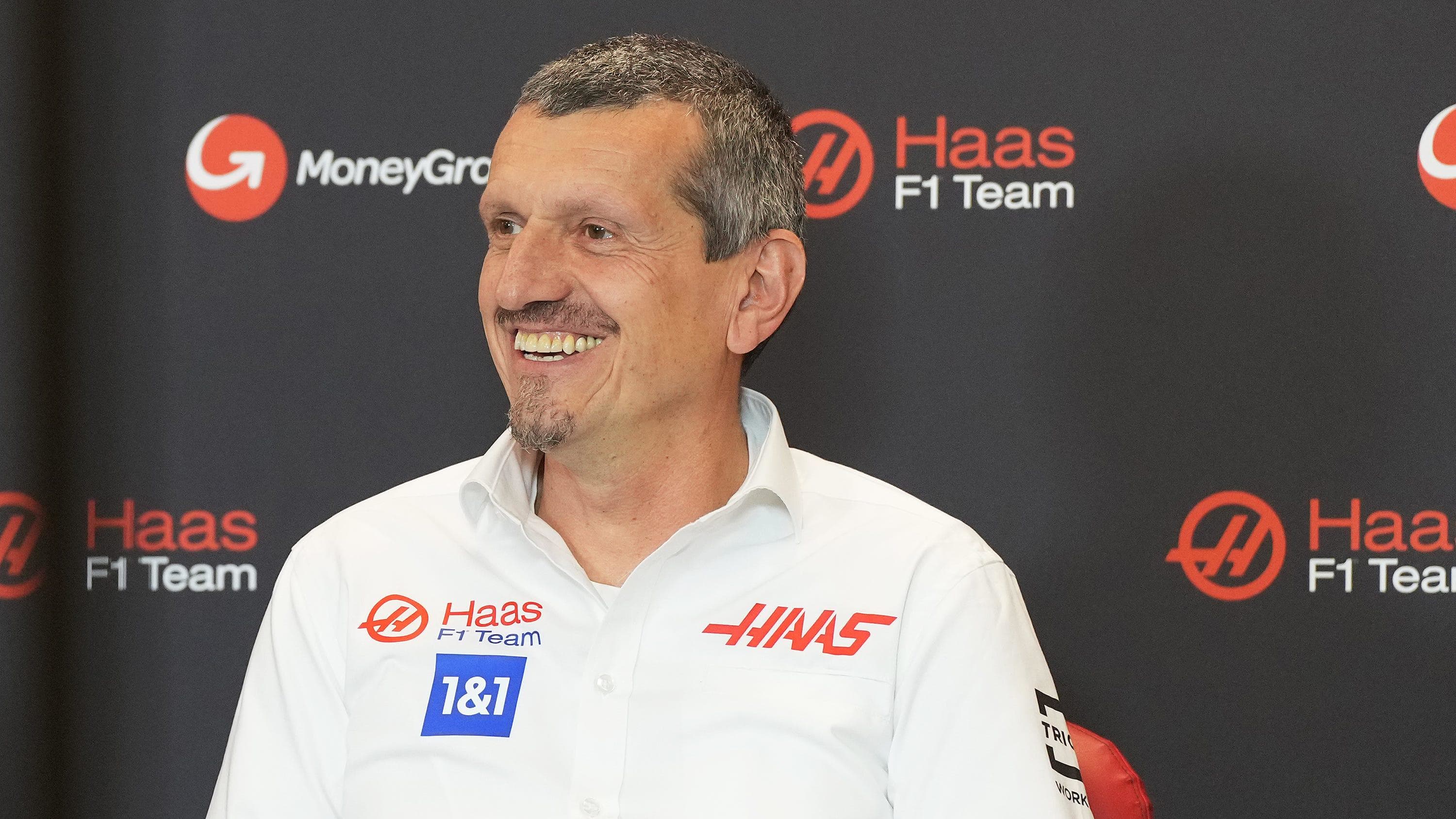 Guenther Steiner, team principal of Haas F1 Team, smiles as the team announces MoneyGram as their