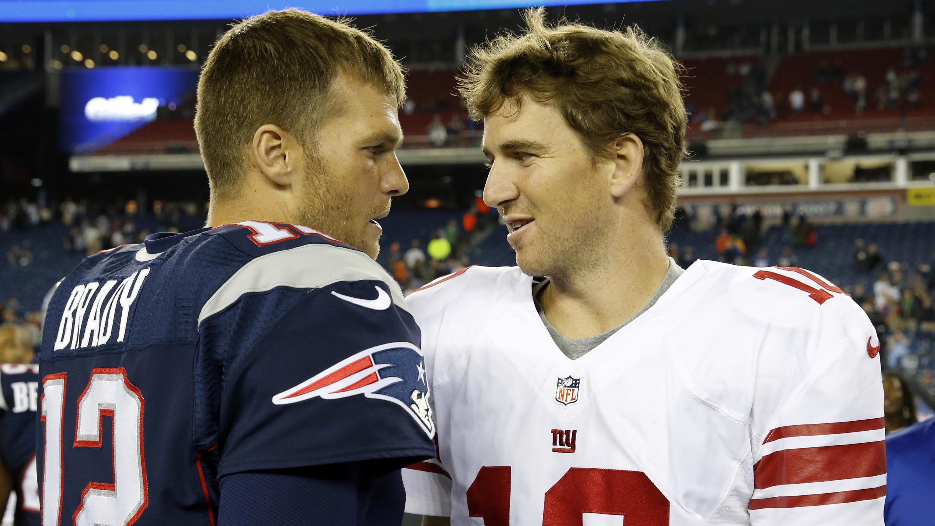 Tom Brady (left) and Eli Manning