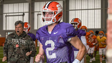 Clemson quarterback Cade Klubnik (2) runs to the outdoor fields with teammates and coaches during Spring Practice in Clemson, S.C. Monday, March 24, 2025.