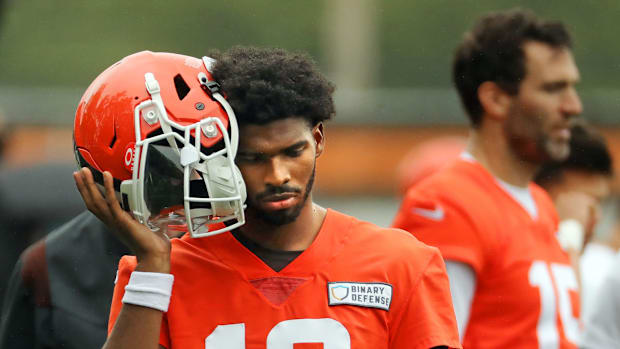 Cleveland Browns quarterback Shedeur Sanders (12) listens to the play calling on the sideline during an NFL practice at the C