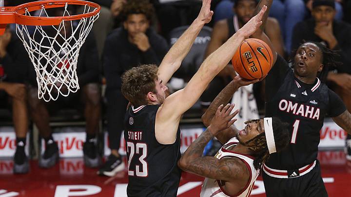 Iowa State Cyclones guard Keshon Gilbert (10) shoots the ball between Omaha Mavericks forward Joshua Streit (23) and guard JJ White (1) during the first half in the NCAA men’s basketball at Hilton Coliseum on Sunday, Dec. 15, 2024, in Ames, Iowa.
