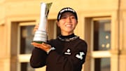 Lydia Ko of New Zealand, poses with the AIG Women's Open trophy on the Old Course at St. Andrews on Aug. 25, 2024. 