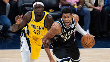 Nov 3, 2025; Indianapolis, Indiana, USA; Milwaukee Bucks forward Giannis Antetokounmpo (34) dribbles against Indiana Pacers forward Pascal Siakam (43) in the first half at Gainbridge Fieldhouse. Mandatory Credit: Trevor Ruszkowski-Imagn Images