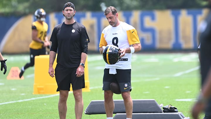 Pittsburgh Steelers quarterback Aaron Rodgers puts on his helmet during minicamp at their South Side facility Pittsburgh Steelers quarterback Aaron Rodgers puts on his helmet during minicamp at their South Side facility