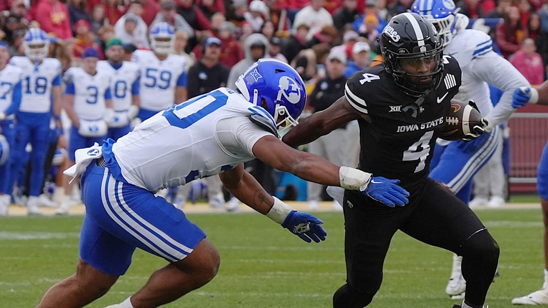 Iowa State Cyclones' wide receiver Xavier Townsend (4) breaks a tackle from BYU Cougars linebacker Max Alford (30) as running for a first down after making a catch during the first quarter at Jack Trice Stadium on Oct. 25, 2025, in Ames, Iowa.