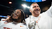 Texas Longhorns running back Jaydon Blue and head coach Steve Sarkisian celebrate a double overtime win over Arizona State.