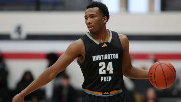 Huntington Prep guard Darryn Peterson takes the ball up the court during the first half at Canton Memorial Field House, Saturday, Feb. 17, 2024.