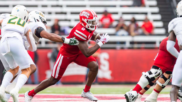 Jacob Kibodi runs the ball as the Louisiana Ragin Cajuns take on Southeastern Louisiana Football  