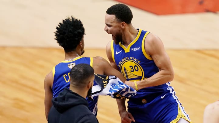 Golden State Warriors guard Quinn Cook (4) and Golden State Warriors guard Stephen Curry (30) celebrate during a time out in the fourth quarter against the Toronto Raptors in game two of the 2019 NBA Finals at Scotiabank Arena. Mandatory Credit: 