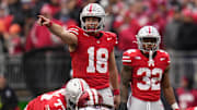 Ohio State Buckeyes quarterback Will Howard (18) signals to his offense during the second half of the NCAA football game against the Indiana Hoosiers at Ohio Stadium in Columbus on Saturday, Nov. 23, 2024. Ohio State won 38-15.