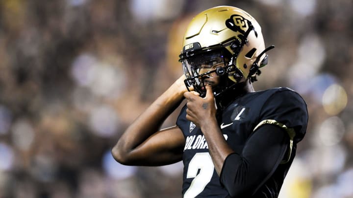 Colorado's Shedeur Sanders (2) tightens his helmet during a college football game against Colorado State at Folsom Field on Saturday, Sep. 16, 2023, in Boulder, Colo.