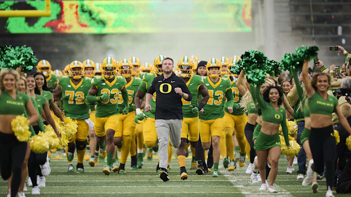 Nov 9, 2024; Eugene, Oregon, USA; Oregon Ducks head coach Dan Lanning leads his team before the start of a game against the Maryland Terrapins at Autzen Stadium. Mandatory Credit: Troy Wayrynen-Imagn Images