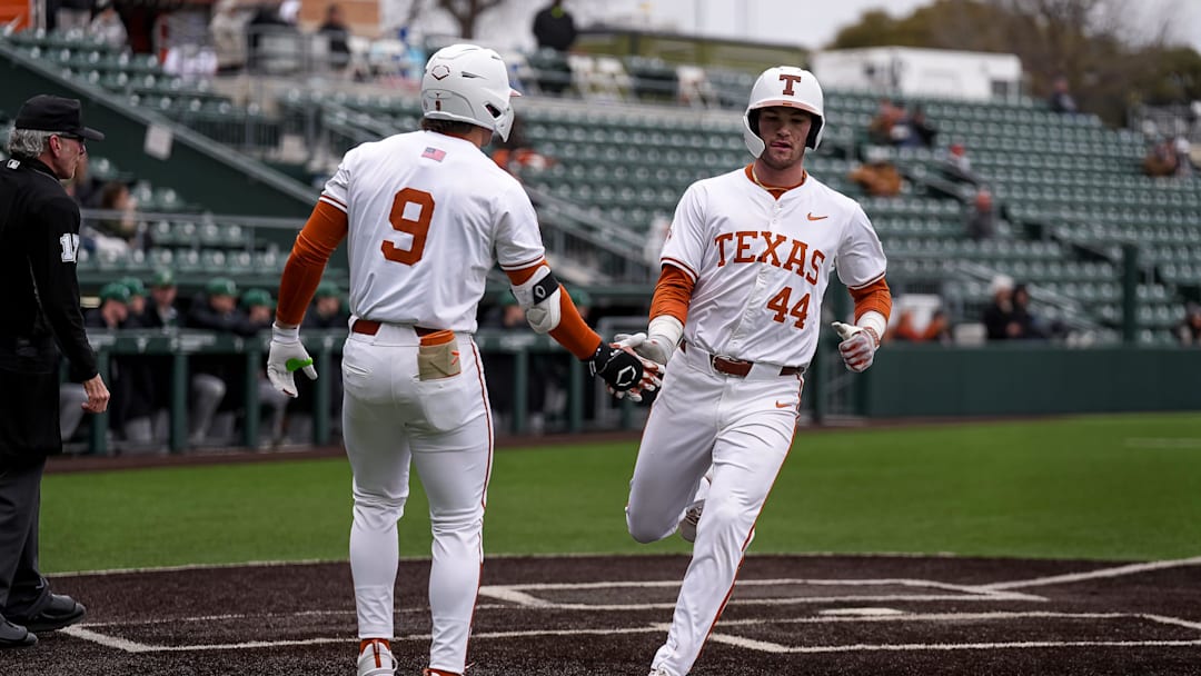 Texas Longhorns outfielders Easton Winfield (9) and Max Belyeu (44) celebrate a score during the game against Dartmouth at UFCU Disch-Falk Field on Friday, Feb. 21, 2025.