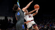 Mar 18, 2023; Dayton, Ohio, United States;  Harvest Prep's Ephraim Campbell (35) is defended by Lutheran East's TJ Crumble (4) during the first quarter of the OHSAA Division III boys basketball semifinal game at the University of Dayton Arena. Mandatory Credit: Joseph Scheller-The Columbus Dispatch

Basketball Division Iii Boys Basketball State Semifinal Africentric At Ottawa Glandorf