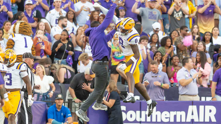 LSU WR Malik Nabors 8 celebrates with Receivers Coach Cortez Hankton after a touchdown as the LSU Tigers take on the Auburn Tigers at Tiger Stadium in Baton Rouge, Louisiana, Saturday, Oct. 14, 2023.