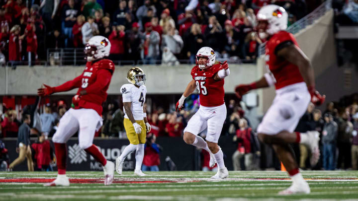 Louisville defensive players celebrated while running off the field as the Cardinals defeated the Notre Dame Fighting Irish, 33-20 on Saturday, Oct. 7, 2023