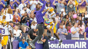 LSU WR Malik Nabers 8 celebrates with Receivers Coach Cortez Hankton after a touchdown as the LSU Tigers take on the Auburn Tigers at Tiger Stadium in Baton Rouge, Louisiana, Saturday, Oct. 14, 2023.