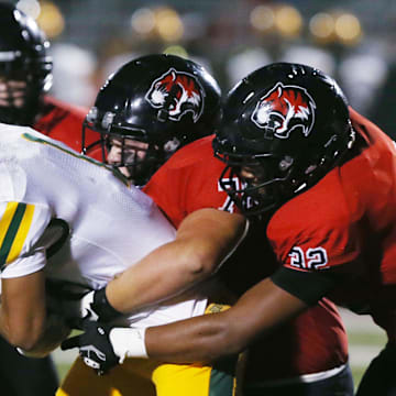 Gilbert' defensive end Tayshawn Gillen (32) is one of the top returning defensive players in Class 4A in Iowa high school football.