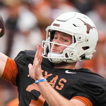 Texas Longhorns quarterback Quinn Ewers (3) throws a pass while warming up ahead of the Longhorns' spring Orange and White game at Darrell K Royal Texas Memorial Stadium in Austin, Texas, April 20, 2024.