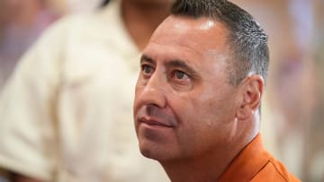 University of Texas football coach Steve Sarkisian listens during the introductory news conference.