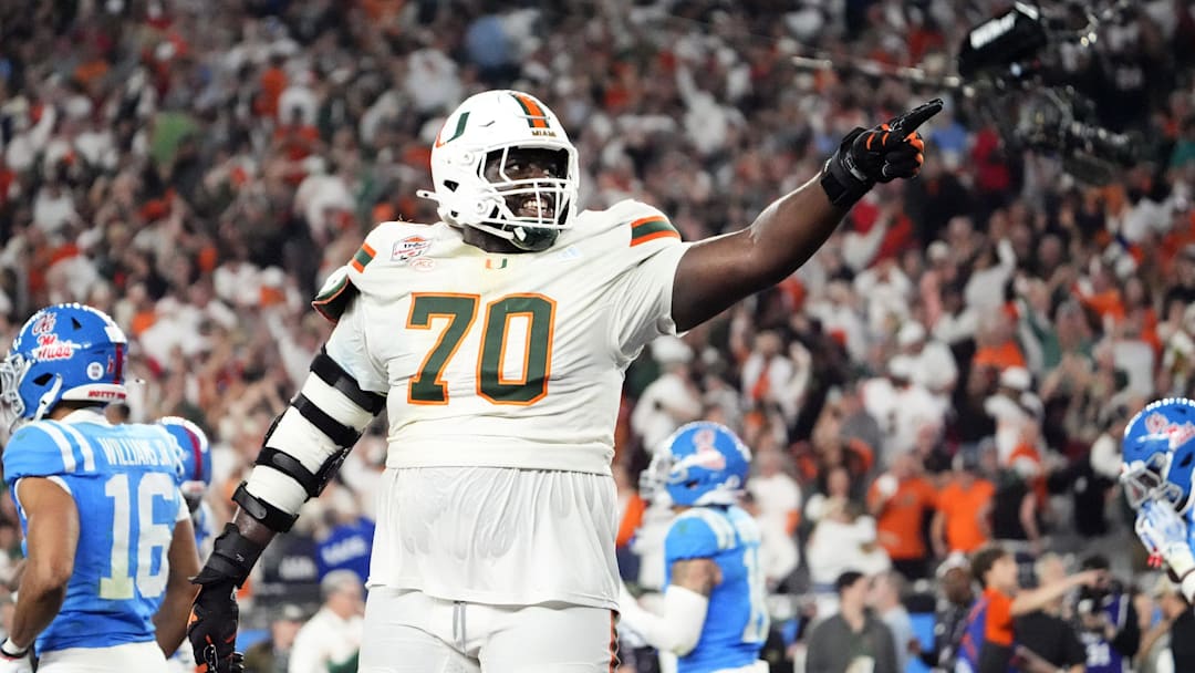 Miami (FL) Hurricanes offensive lineman Markel Bell (70) celebrates after going up 31-27 against the Mississippi Rebels late in the fourth quarter during the Vrbo Fiesta Bowl and CFP semifinal game at State Farm Stadium on Jan. 8, 2026, in Glendale.