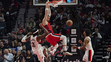 Jan 16, 2025; Portland, Oregon, USA; LA Clippers center Ivica Zubac (40) dunks the basketball during the second half against Portland Trail Blazers center Robert Williams III (35) and guard Scoot Henderson (00) at Moda Center. Mandatory Credit: Troy Wayrynen-Imagn Images