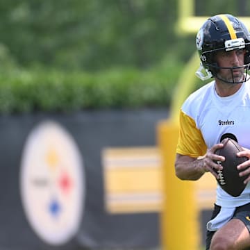 Pittsburgh Steelers quarterback Aaron Rodgers (8) drops back to pass during minicamp at their South Side facility. 