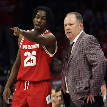 Dec 9, 2023; Tucson, Arizona, USA; Wisconsin Badgers guard John Blackwell (25) talks to Wisconsin Badgers head coach Greg Gard during the second half at McKale Center.