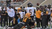 Bethune-Cookman’s Kevin Washington Jr. (14) hits Grambling State's Deljay Bailey (5) on Saturday, Nov. 2, 2024 at Daytona Stadium.