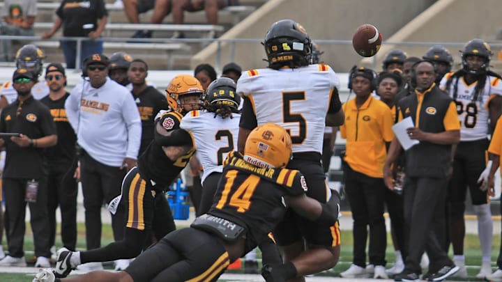 Bethune-Cookman’s Kevin Washington Jr. (14) hits Grambling State's Deljay Bailey (5) on Saturday, Nov. 2, 2024 at Daytona Stadium. Bethune-Cookman’s Kevin Washington Jr. (14) hits Grambling State's Deljay Bailey (5) on Saturday, Nov. 2, 2024 at Daytona Stadium.